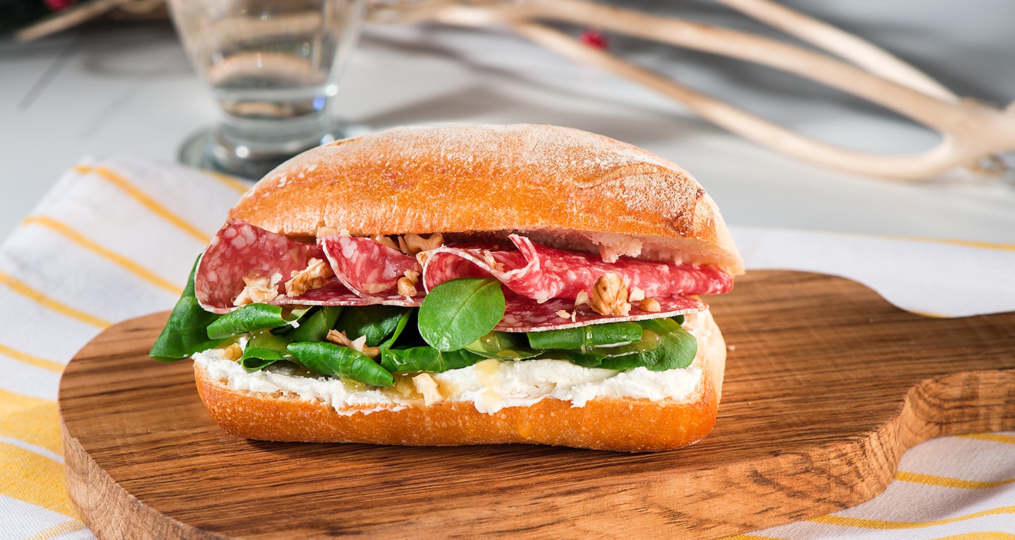 SANDWICH WITH SALAMI, ROBIOLA CHEESE, HONEY, SONCINO SALAD AND NUTS